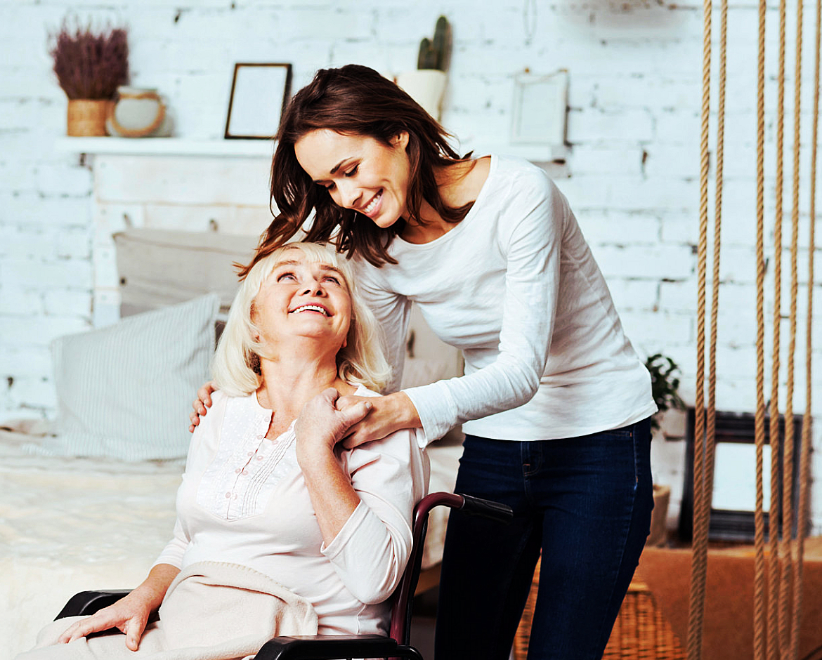 caregiver comforting senior woman